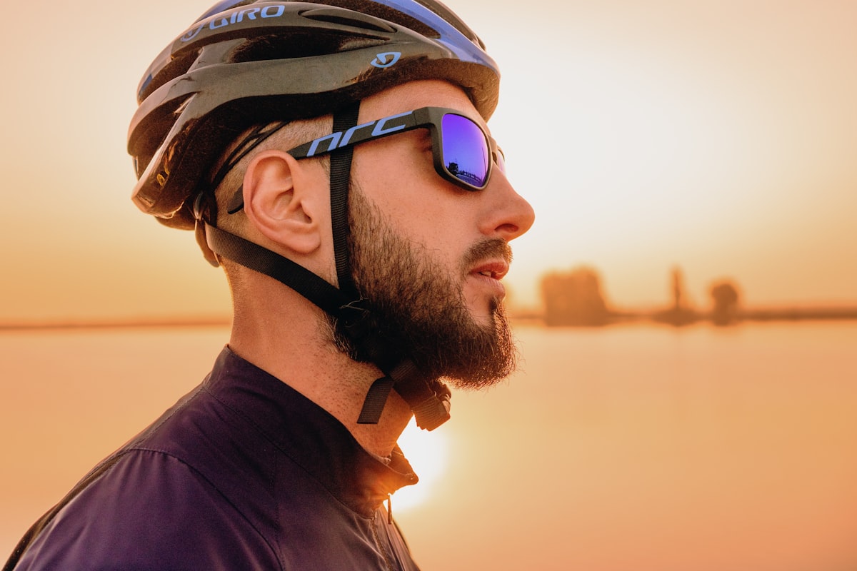 Cyclist wearing Giro road helmet at sunset