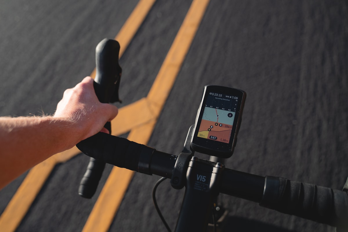 GPS bike computer on the handlebar showing live map navigation