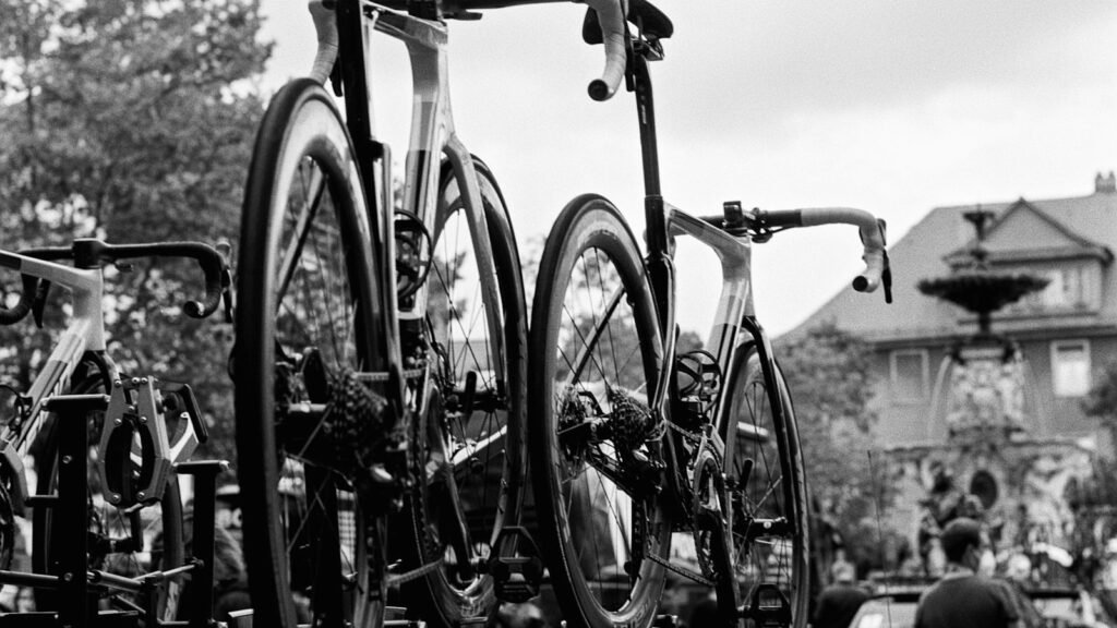 Two bicycles mounted on a roof rack on top of a car, ready for a road trip