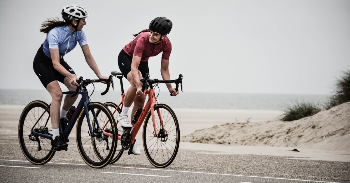 Road cyclists riding with clipless cycling shoes on a coastal route