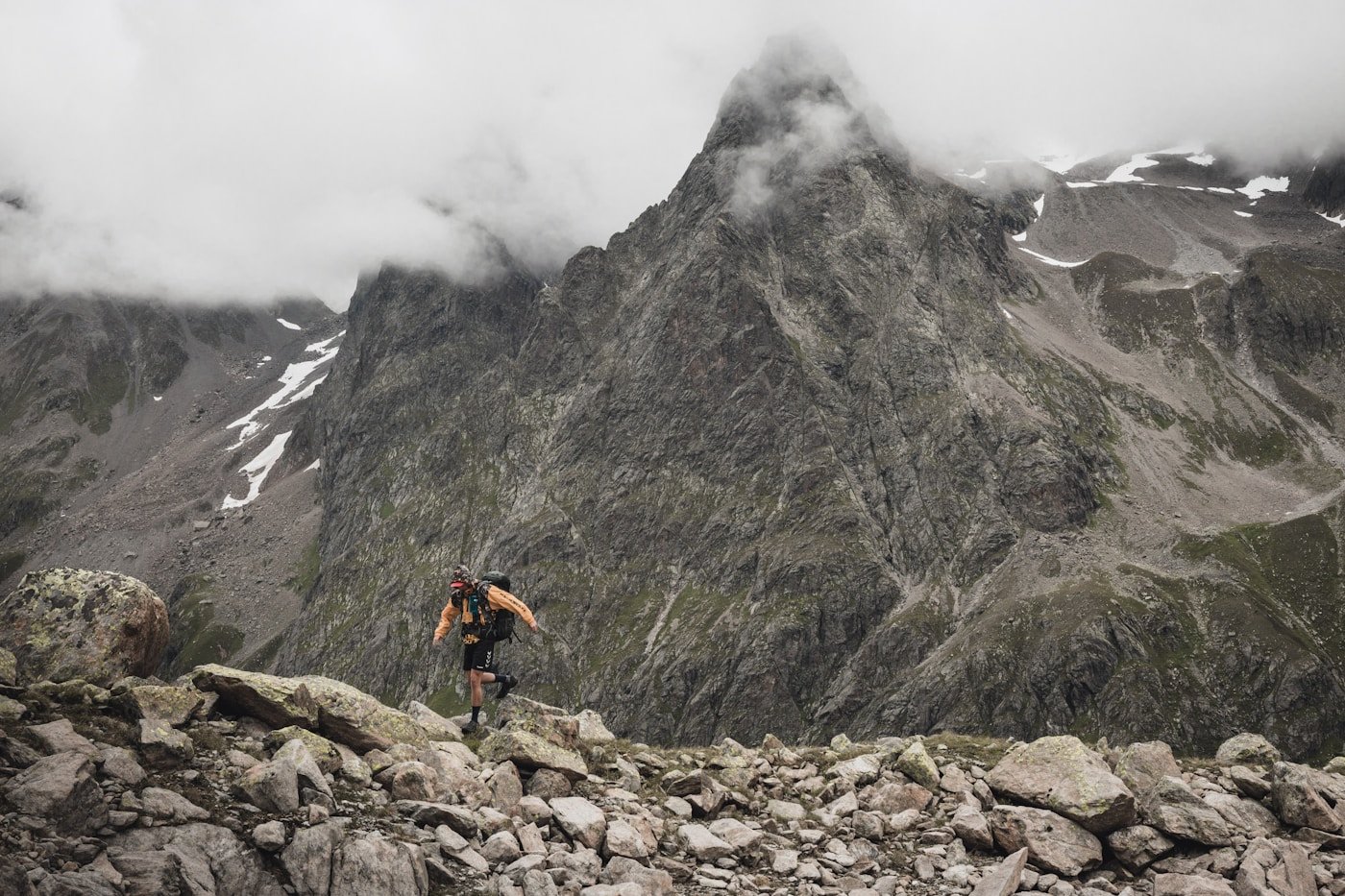 Mountain biker riding rocky trail in the Alps — MTB 2026